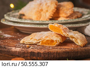 A crescent-shaped pastry whose filling is made of eggs and almonds wrapped in crispy dough, cut in an artisanal way and sprinkled with sugar. Стоковое фото, агентство Ingram Publishing / Фотобанк Лори