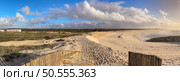 OVAR, PORTUGAL - DECEMBER 4 2023: Low tide reveals what’s left of the sand on beach on the south beach of Furadouro in Ovar. Редакционное фото, агентство Ingram Publishing / Фотобанк Лори