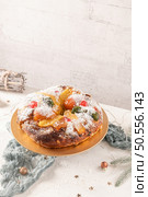 Bolo do Rei or King’s Cake, Made for Christmas, Carnavale or Mardi Gras with Christmas season elements in Background. Стоковое фото, агентство Ingram Publishing / Фотобанк Лори