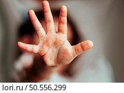girl covers the camera lens with her hand not willing to be photographed , blonde hair female refuse to take with picture. Стоковое фото, агентство Ingram Publishing / Фотобанк Лори
