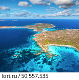 Aerial view of islands, sea bay, yachts and boats at summer sunny day. Travel in Sardinia, Italy. Drone view from above of rocky coast, mountain, sea lagoon, transparent azure water, sky. Seascape. Стоковое фото, агентство Ingram Publishing / Фотобанк Лори