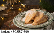 A crescent-shaped pastry whose filling is made of eggs and almonds wrapped in crispy dough, cut in an artisanal way and sprinkled with sugar. Стоковое фото, агентство Ingram Publishing / Фотобанк Лори