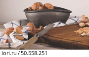 Walnuts, hazelnuts, peanuts and nuts on wooden table. Стоковое фото, агентство Ingram Publishing / Фотобанк Лори