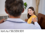 Obstetrician gynecologist and vaccination needle or pregnant woman, Asian pregnant woman visit gynecologist doctor at medical clinic for pregnancy consultant. Стоковое фото, агентство Ingram Publishing / Фотобанк Лори