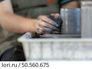 hands of a potter, creating an earthen jar on the pottery wheel. Стоковое фото, агентство Ingram Publishing / Фотобанк Лори