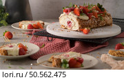Meringue roll cake with cream, raspberries. Roulade, summer dessert served in ceramic plate. Стоковое фото, агентство Ingram Publishing / Фотобанк Лори