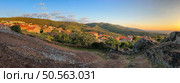 Panoramic view of a quaint town at sunset with surrounding hills. Linhares da Beira - Portugal. Стоковое фото, агентство Ingram Publishing / Фотобанк Лори