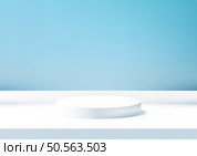 Minimalist 3D White Podium Against Serene Blue Wall for Product Display, Perfect for Clean and Modern Showroom or Showcase Mockup in a Calming Environment. Стоковая иллюстрация, агентство Ingram Publishing / Фотобанк Лори