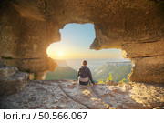 Young woman in cave mountain. Conceptual scene. Стоковое фото, агентство Ingram Publishing / Фотобанк Лори