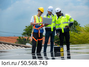 Group of engineer and technician inspects solar panel installation and test the operation of the panel. Стоковое фото, агентство Ingram Publishing / Фотобанк Лори