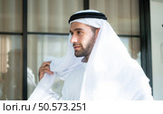 Portrait of a handsome young Arabic man in traditional clothes. Стоковое фото, агентство Ingram Publishing / Фотобанк Лори