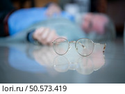 An elderly businessman fell to the floor with sudden heart failure at work. Стоковое фото, агентство Ingram Publishing / Фотобанк Лори