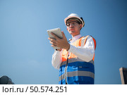 Engineers inspect the completed air conditioning and water systems to continue verifying their functionality. Стоковое фото, агентство Ingram Publishing / Фотобанк Лори