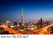 Amazing sunset dubai downtown skyline with tallest skyscrapers and beautiful blue sky, Dubai, United Arab Emirates. Стоковое фото, агентство Ingram Publishing / Фотобанк Лори