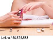 Woman hands during manicure session. Стоковое фото, агентство Ingram Publishing / Фотобанк Лори