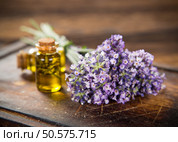 Wellness treatments with lavender flowers on wooden table. Spa still-life.. Wellness treatments with lavender flowers on wooden table. Стоковое фото, агентство Ingram Publishing / Фотобанк Лори