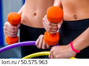 Hula hoop woman and group people working with dumbbells gym. Стоковое фото, агентство Ingram Publishing / Фотобанк Лори