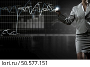 Hand of businesswoman drawing virtual infographs on media screen. Innovative technologies for your business . Mixed media. Стоковое фото, агентство Ingram Publishing / Фотобанк Лори