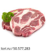 Raw pork neck chop meat with parsley herb leaves garnish isolated on white background cutout. Стоковое фото, агентство Ingram Publishing / Фотобанк Лори