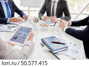 Business people working in team at the table. People at meeting. Стоковое фото, агентство Ingram Publishing / Фотобанк Лори