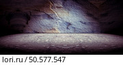 Cement floor and rock wall background and spotlight. Concrete and rock floor background. Стоковое фото, агентство Ingram Publishing / Фотобанк Лори
