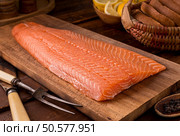 A delicious salmon fillet on a cedar plank. Стоковое фото, агентство Ingram Publishing / Фотобанк Лори