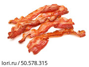 Cooked bacon rashers isolated on white. Стоковое фото, агентство Ingram Publishing / Фотобанк Лори