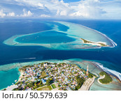Maldives paradise scenery. Tropical aerial landscape, seascape with long jetty, water villas with amazing sea and lagoon beach, tropical nature. Exotic tourism destination banner, summer vacation. Стоковое фото, агентство Ingram Publishing / Фотобанк Лори