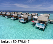 Maldives paradise scenery. Tropical aerial landscape, seascape with long jetty, water villas with amazing sea and lagoon beach, tropical nature. Exotic tourism destination banner, summer vacation. Стоковое фото, агентство Ingram Publishing / Фотобанк Лори