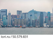 Modern Hong Kong Skyline Featuring Many Commercial Buildings and Signage (2024 год). Редакционное фото, фотограф Aleksandr Golubev / Фотобанк Лори