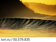 wave breaking on sea at sunset in Azkorri. Стоковое фото, агентство Ingram Publishing / Фотобанк Лори