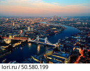 London aerial view panorama blended with sunset and night with urban architectures. Стоковое фото, агентство Ingram Publishing / Фотобанк Лори