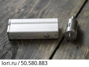 Advanced personal vaporizer or e-cigarette, close up. Стоковое фото, агентство Ingram Publishing / Фотобанк Лори