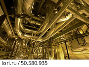 Pipes, tubes, machinery and steam turbine at a power plant        . Стоковое фото, агентство Ingram Publishing / Фотобанк Лори