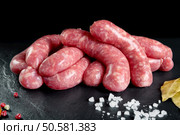 Raw and fresh meat. Fresh sausages and chicken meat ready to cook. Стоковое фото, агентство Ingram Publishing / Фотобанк Лори