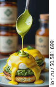A close-up of a spoonful of matcha-infused hollandaise sauce drizzling over eggs Benedict, green and yellow hues contrasting beautiful kitchen background. Стоковое AI-видео, аниматор Sergey Grishin / Фотобанк Лори