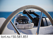 Sailing yacht control wheel and implement. Horizontal shot without people. Стоковое фото, агентство Ingram Publishing / Фотобанк Лори