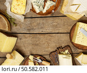 Various types of cheese on rustic background, with copy space. Стоковое фото, агентство Ingram Publishing / Фотобанк Лори