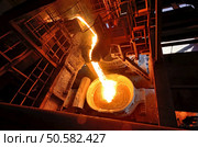 Liquid metal from blast furnace on trail. Стоковое фото, агентство Ingram Publishing / Фотобанк Лори