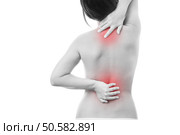 Pain in back of women. Isolated on white background. Caring for the female body. Red dot. Стоковое фото, агентство Ingram Publishing / Фотобанк Лори