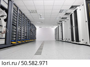 internet network server room with computers racks and digital receiver for digital tv. Стоковое фото, агентство Ingram Publishing / Фотобанк Лори
