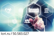 A businessman pressing a Reserach button on a transparent screen.. Tech screen Business Reserach Concept. Стоковое фото, агентство Ingram Publishing / Фотобанк Лори