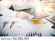 Picture man touching modern tablet screen.Investment manager working new private banking project office.Using electronic device.Graphic icons,stock exchanges reports table. Film effect. Picture man touching modern tablet screen.Trader manager working new private banking project office.Using electronic device.Graphic icons,stock exchanges reports table. Horizontal.Film effect. Стоковое фото, агентство Ingram Publishing / Фотобанк Лори