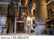 Pipes, tubes, machinery and steam turbine at a power plant. Стоковое фото, агентство Ingram Publishing / Фотобанк Лори