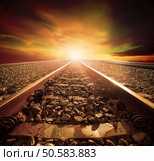 junction of railways track in trains station agains beautiful light of sun set sky use for land transport and logistic industry background ,backdrop,copy space theme. Стоковое фото, агентство Ingram Publishing / Фотобанк Лори