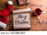 Empty wishlist for Santa Claus laid on a wooden table. Empty wishlist for Santa. Стоковое фото, агентство Ingram Publishing / Фотобанк Лори
