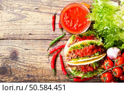 mexican tacos with meat and salsa on a wooden table, top view. Стоковое фото, агентство Ingram Publishing / Фотобанк Лори