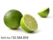 freshly cut limes on a white back ground. Стоковое фото, агентство Ingram Publishing / Фотобанк Лори