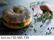 Sandwich with poppy seeds and lox on blackboard. Стоковое фото, агентство Ingram Publishing / Фотобанк Лори