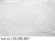 white crumpled and creased glued wrinkled paper poster texture background. Стоковое фото, агентство Ingram Publishing / Фотобанк Лори